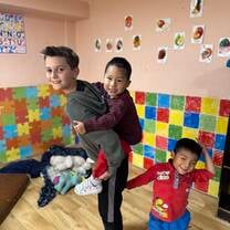 Our son playing with the kids
