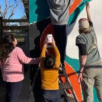 Helpers with mural