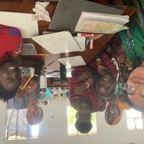 Teaching English class and learning Swahili at the YaKairo GIVE school to a group of Masai tribesmen