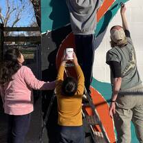 Helpers with mural