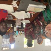 Teaching English class and learning Swahili at the YaKairo GIVE school to a group of Masai tribesmen