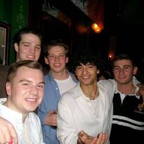 A couple of my friends including my Italian roommate and me.