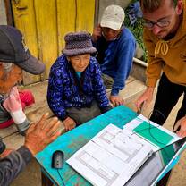Showing building designs to a local family