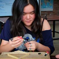Creating a model to show the design of a cabin for a local family.