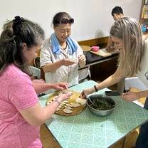 Making dumplings at Volunteer House with our host