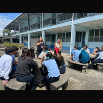 me and sawyer teaching english games outside with teacher 