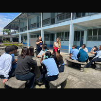 me and sawyer teaching english games outside with teacher 