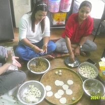 Making momos under the guidance of my homestay mom, (right) and homestay aunt. 