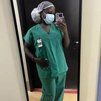 A picture of me before entering a public hospital's recovery room/ICU, where I shadowed physicians.