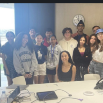 A picture of me and all my classmates in class with our tutor.