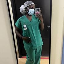 A picture of me before entering a public hospital's recovery room/ICU, where I shadowed physicians.