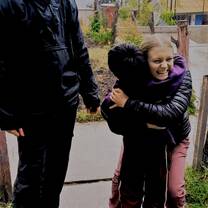 Me and my best friend I made on program with one of our new friends from a village we visited. 