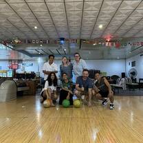 The local team and volunteers bowling in Laos