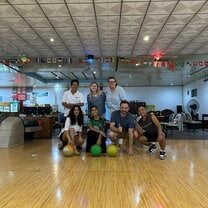 The local team and volunteers bowling in Laos