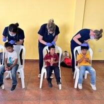 Checking children’s head for lice 