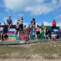 Posing in front of the Belize sign