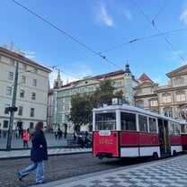 a typicaly tram and the city square where it has a stop in prague