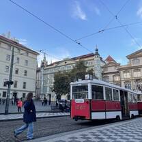 a typicaly tram and the city square where it has a stop in prague