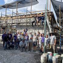 Volunteers, staff and local workers after a successful concrete pour