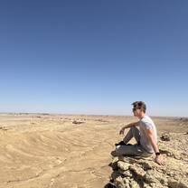 Sitting dangerously close to the edge at "the edge of the world" in Riyadh.