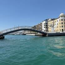 The yellow building is the university which is located directly on the port.