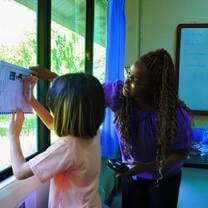 Helping a student at camp with her work