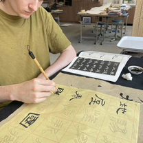 Offered calligraphy lessons by the school art teacher