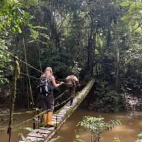 Hiking on a trail at Tiputini Biodiversity Station in the Amazon with a guide