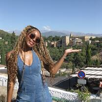 This is me and the Alhambra in the background. The Alhambra is a stunning palace and fortress complex in Granada, Spain.
