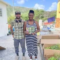 Assisting a local farmer with planting and garden setup