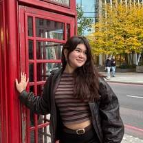 My roommate taking a picture of me after we aimlessly roamed around London. 