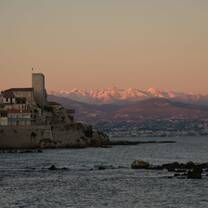 Snow caped alps from the beach in Antibes