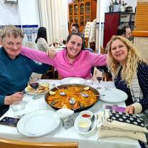 Sharing paella and laughter with Mónica and Pilar—Spain at its best