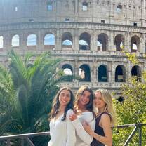 My new friends and I in front of the Colosseum!