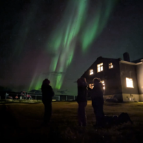 A few of us taking in the magical northern lights on Grímsey, an island off the north coast of Iceland