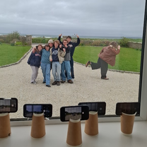 Taking one picture on seven different phones with homemade tripods :)