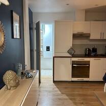 Apartment kitchen and bathroom entrance.
