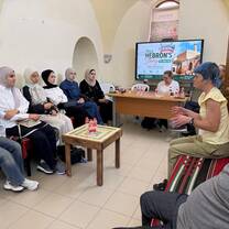 Chatting and sharing views in English with graduate tourism and architecture students at the Hebron Tourism Center