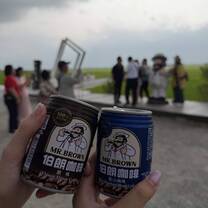 Drinking Mr. Brown coffee on Mr. Brown Boulevard in Taitung