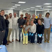 My cohort and I in a sun skills lab learning to suture and work with various surgical tools!