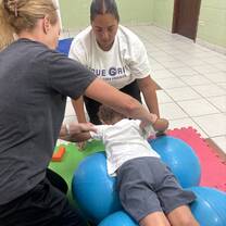 Working on head/neck extension/elevation while activating core muscles for stability and postural control. to build trunk support