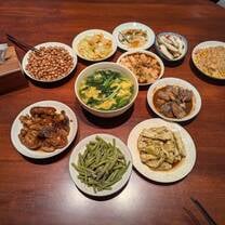 A typical dinner served by my host family (with pig's feet in the bottom left corner!)