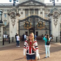 Female intern posing at Buckingham Palace in London!