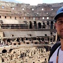 A male intern posing in front of the Colosseum in Rome, Italy!
