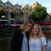 Two woman posing near a canal in The Netherlands.