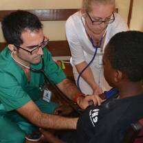 Projects Abroad Medicine interns with child in Jamaica