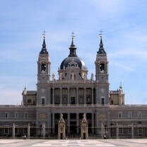 People enjoying outdoor cafes, historic landmarks, and art museums in Madrid, Spain.