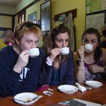 three people drinking coffee