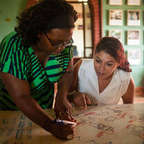 Summer 2014 Intern Kerrian teaching English at our Community Center