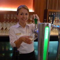 INTERNeX participant pouring a pint at an Auckland 5 Star Hotel